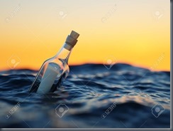 Glass bottle with letter in the sea